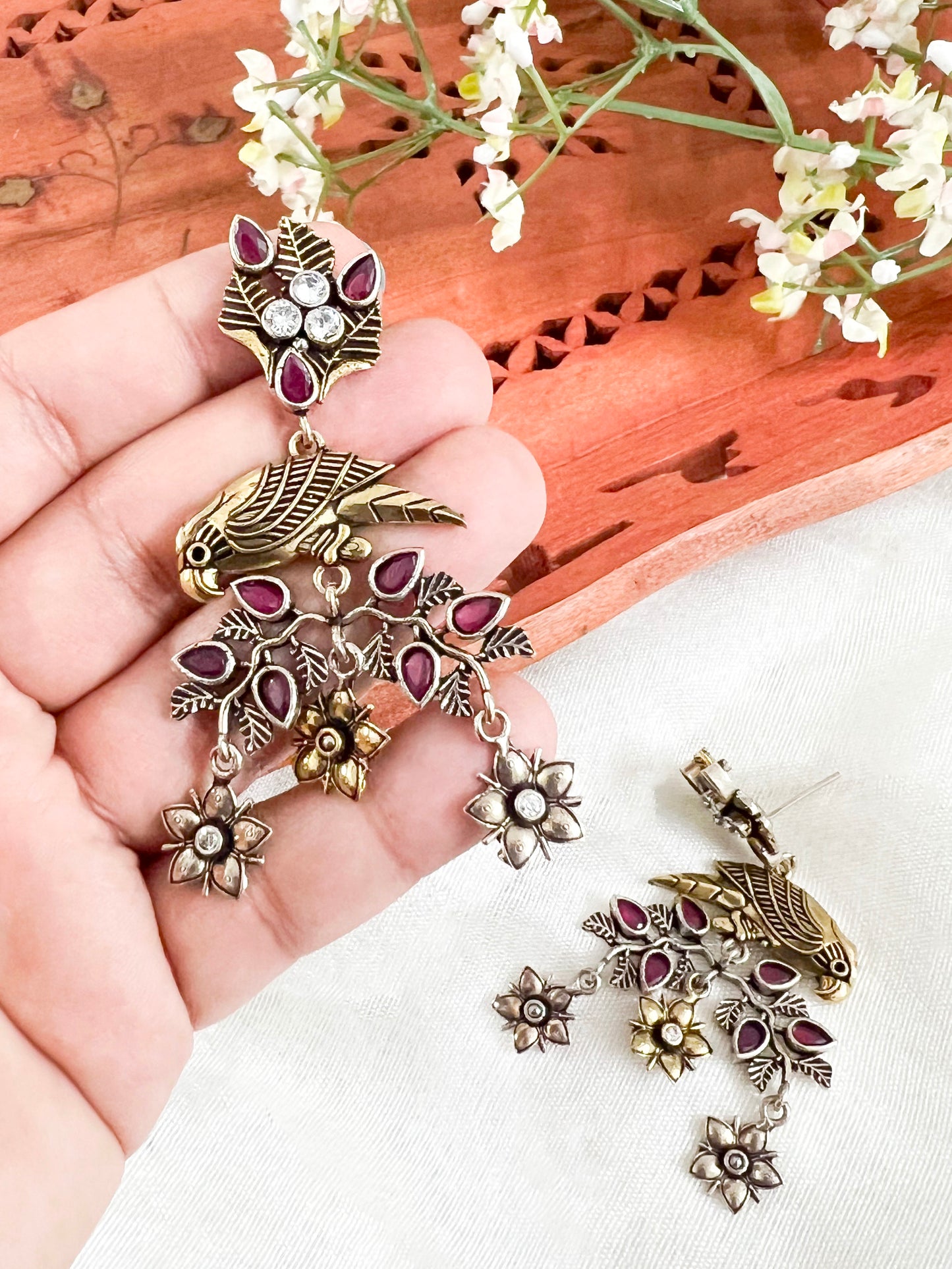 Dual Tone Silver Replica Parrot Dangle Earrings available in Two Color variants : Black/Ruby
