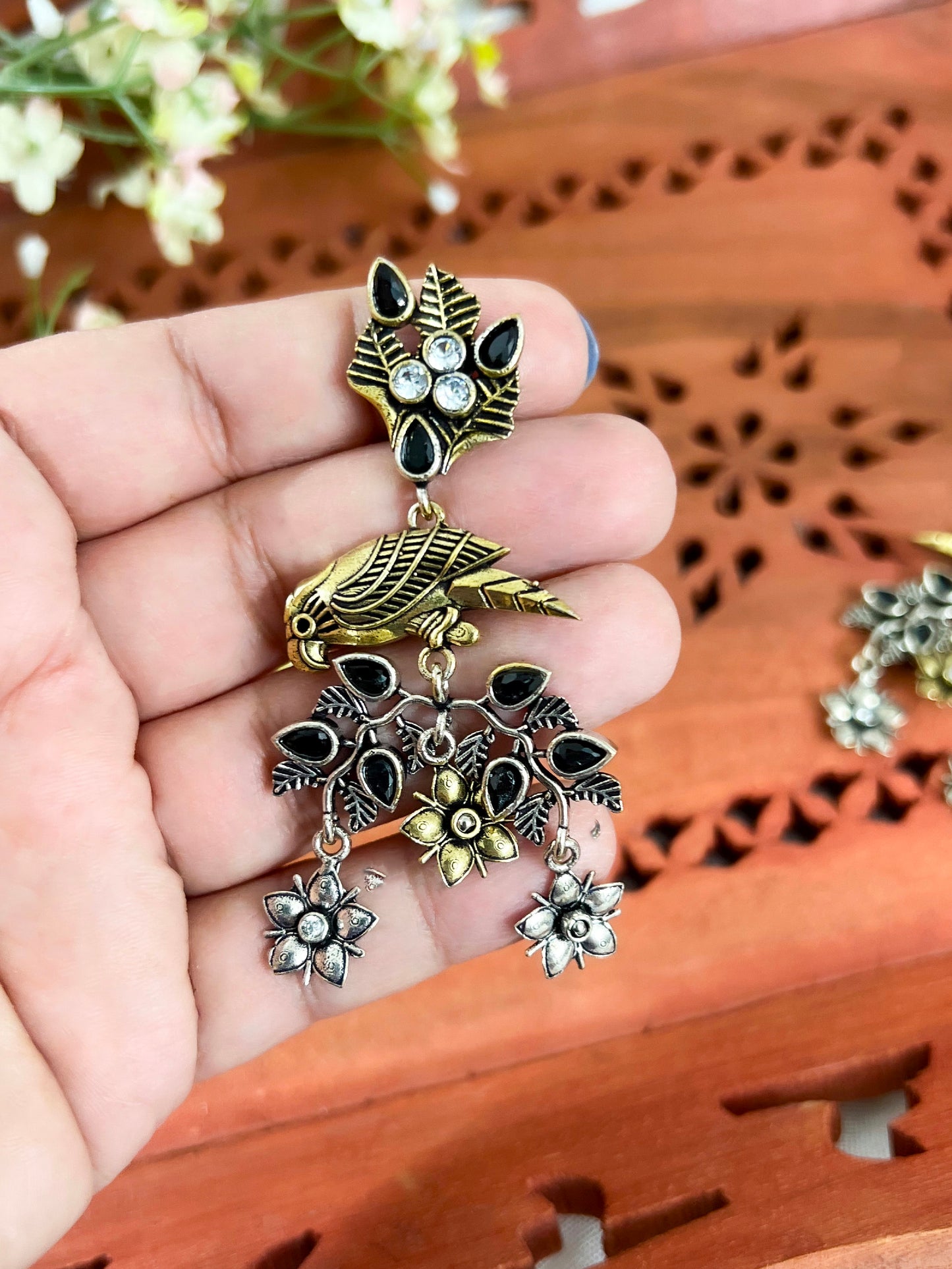Dual Tone Silver Replica Parrot Dangle Earrings available in Two Color variants : Black/Ruby