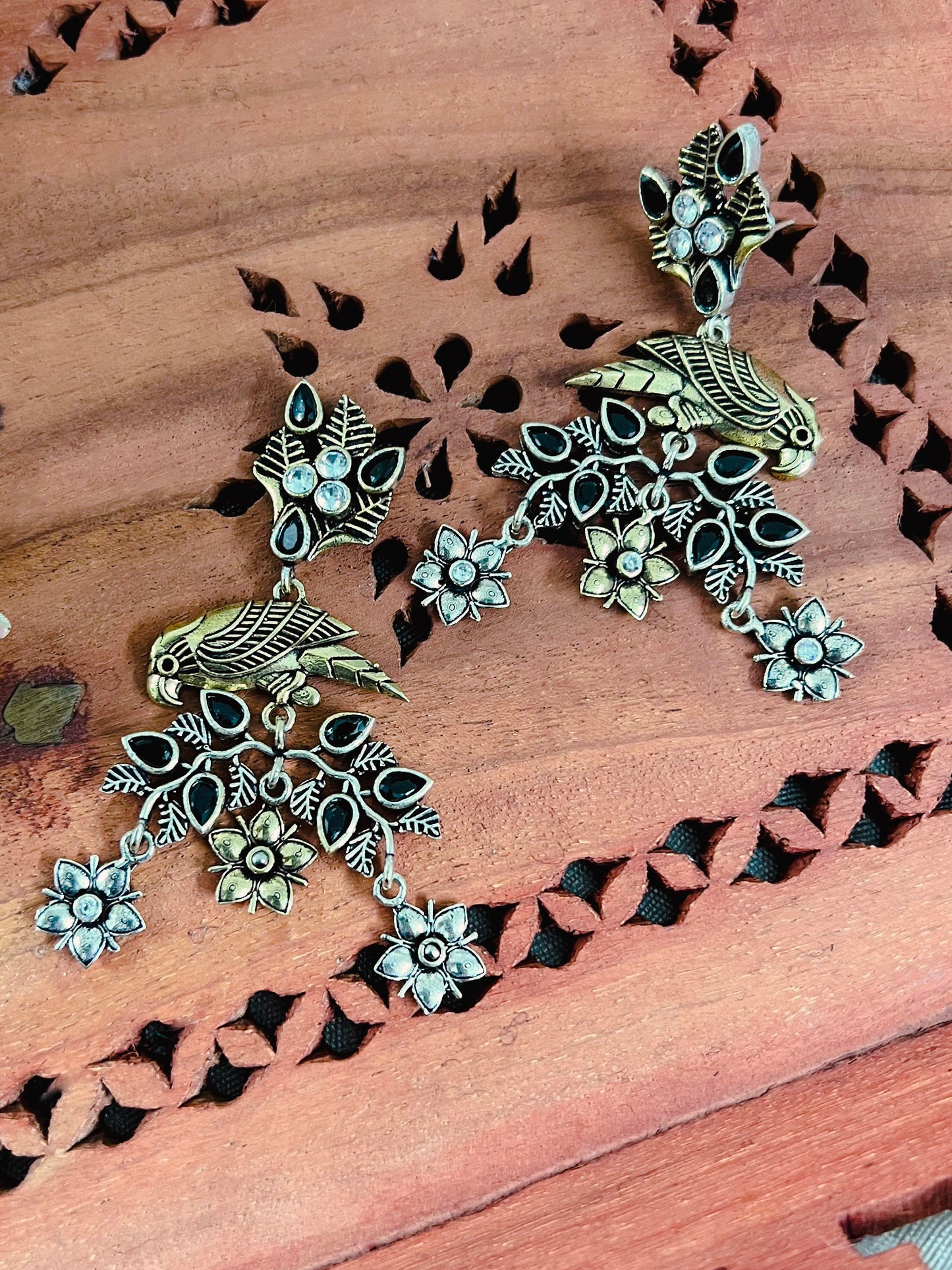 Dual Tone Silver Replica Parrot Dangle Earrings available in Two Color variants : Black/Ruby