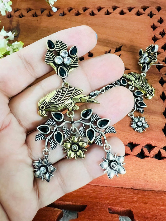 Dual Tone Silver Replica Parrot Dangle Earrings available in Two Color variants : Black/Ruby