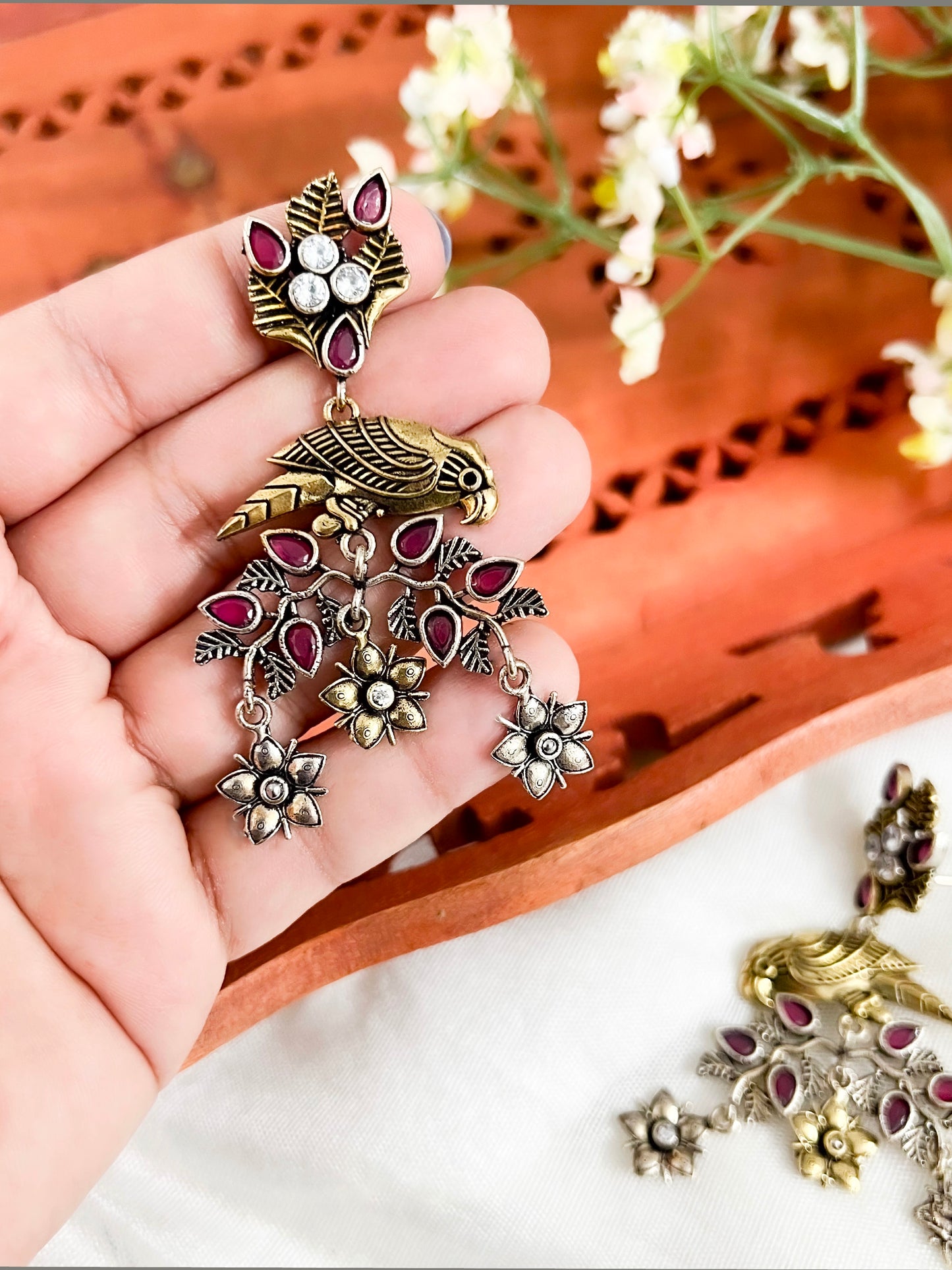 Dual Tone Silver Replica Parrot Dangle Earrings available in Two Color variants : Black/Ruby